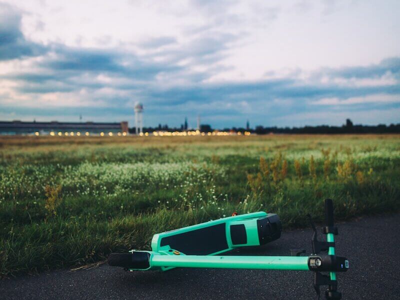 green and black skateboard on road during daytime