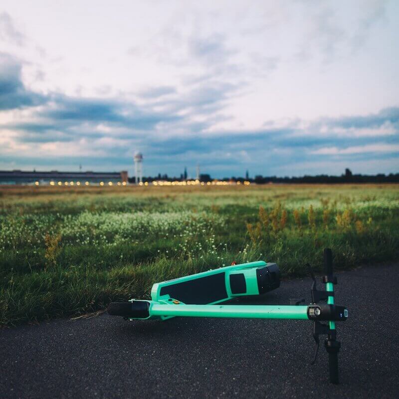 green and black skateboard on road during daytime